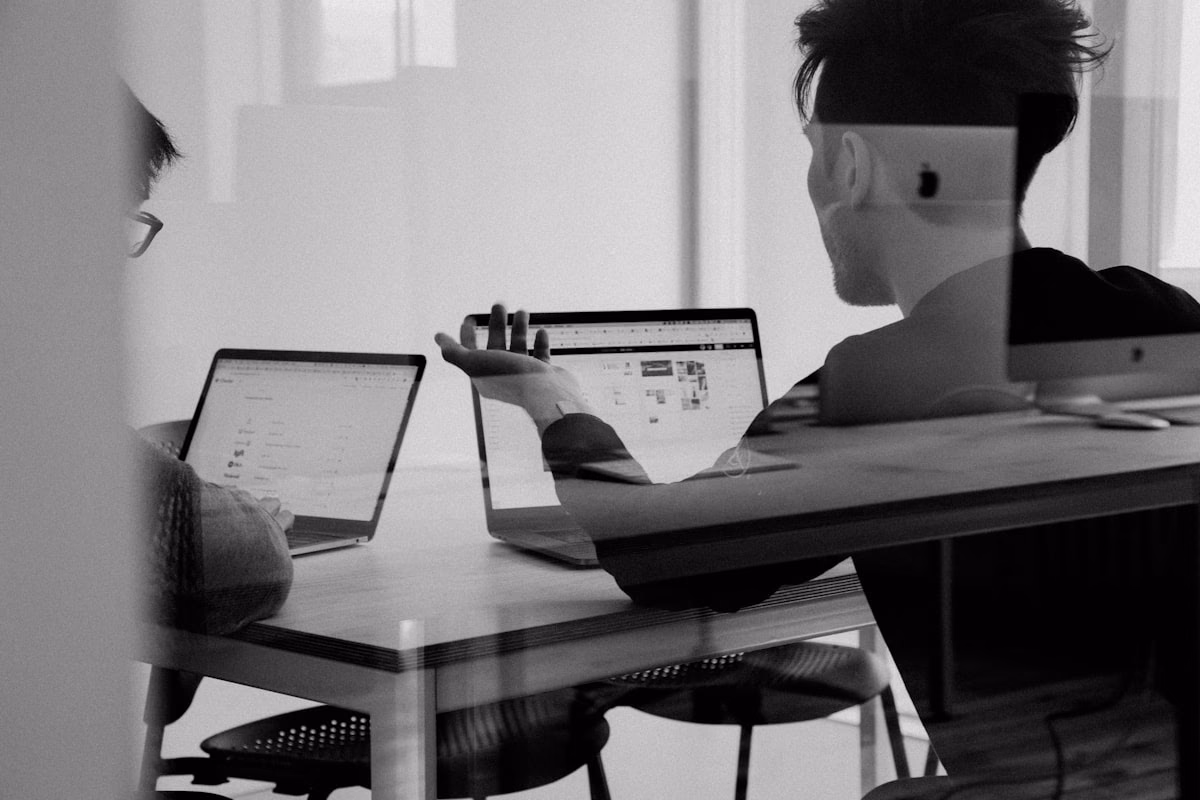 Developer and colleague reviewing a secure application